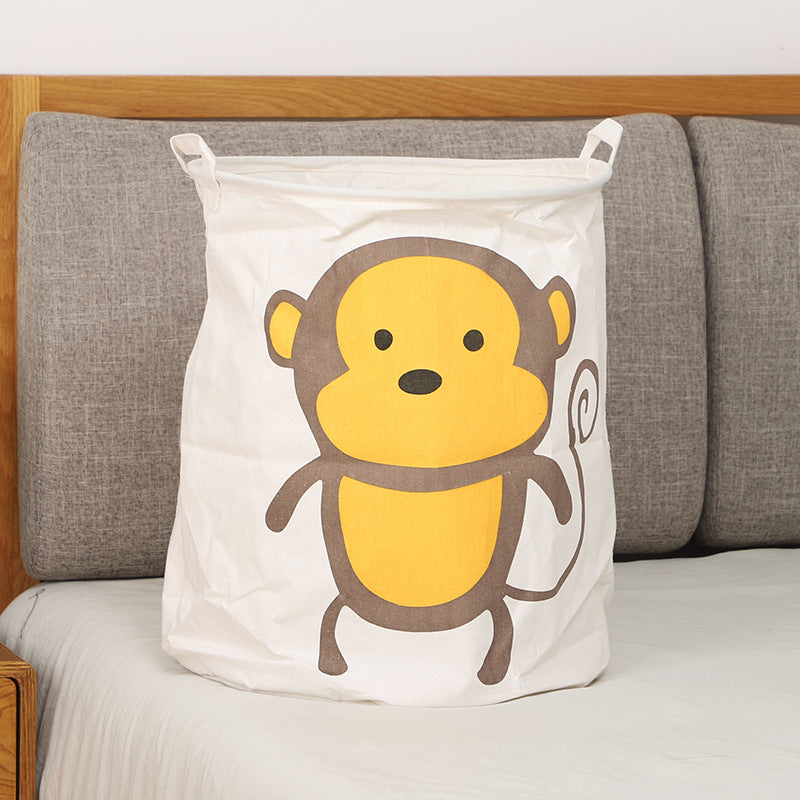 Panier à linge motif singe, idéal pour chambre enfant.