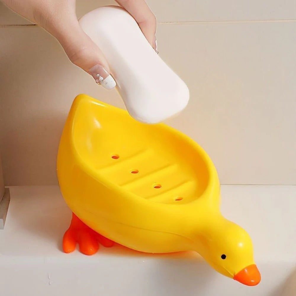 Porte-savon rigolo en forme de canard jaune, idéal pour salle de bain enfant.
